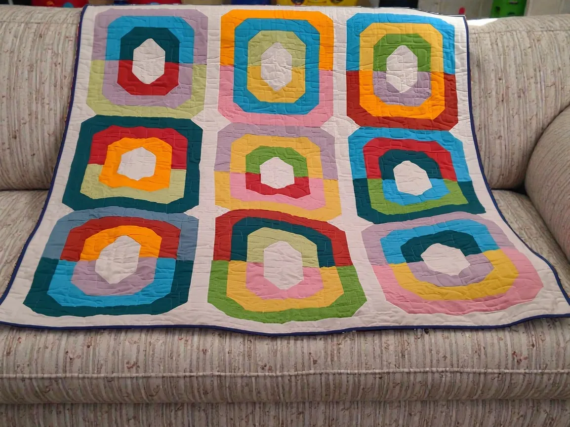 Quilt mit geometrischem Muster in Regenbogenfarben aus Baumwolle